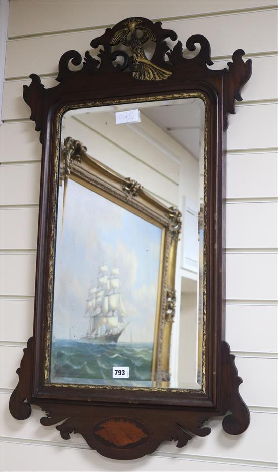 A mahogany fret cut shell inlaid wall mirror W.51cm